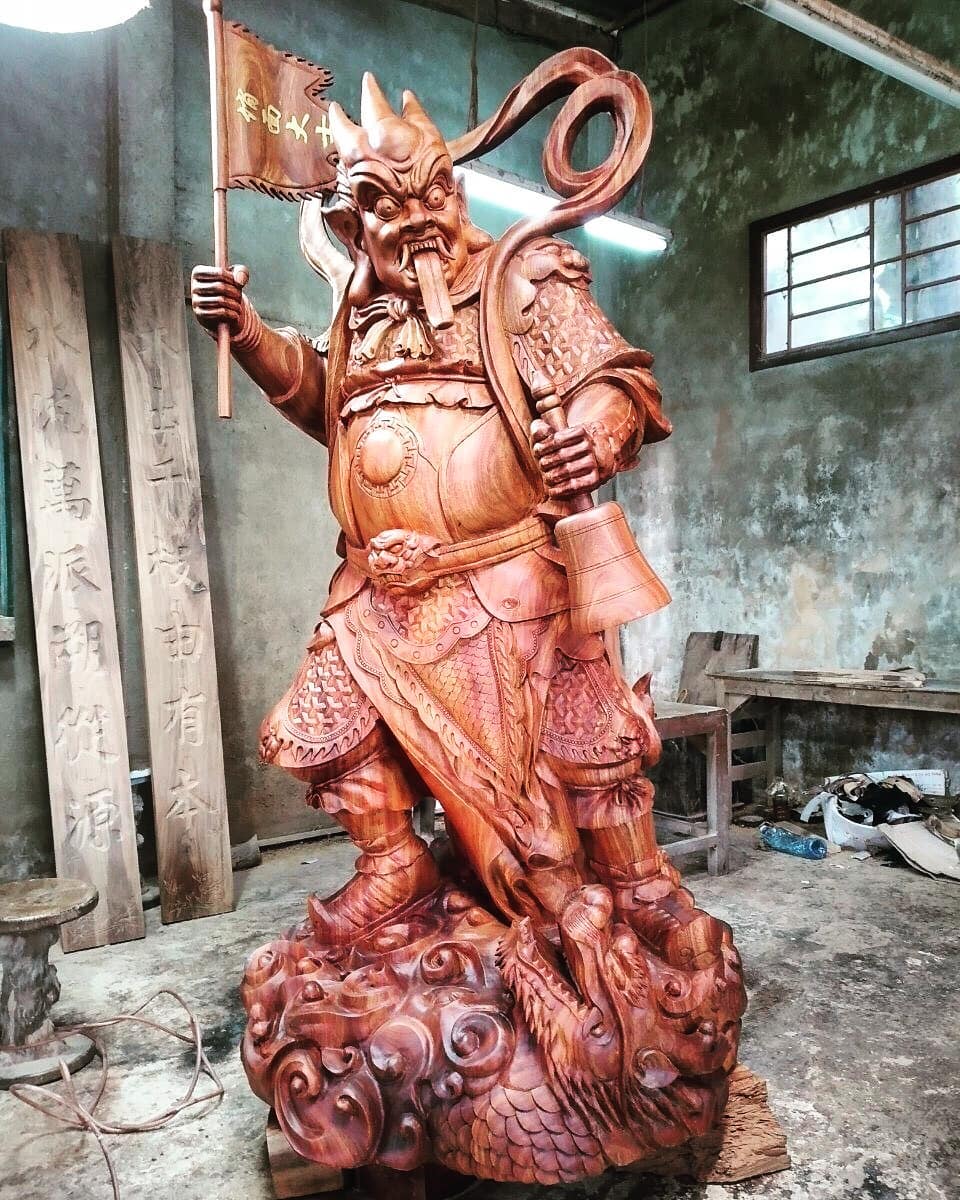 It took us 100days to turn the huge log of wood into a God statue