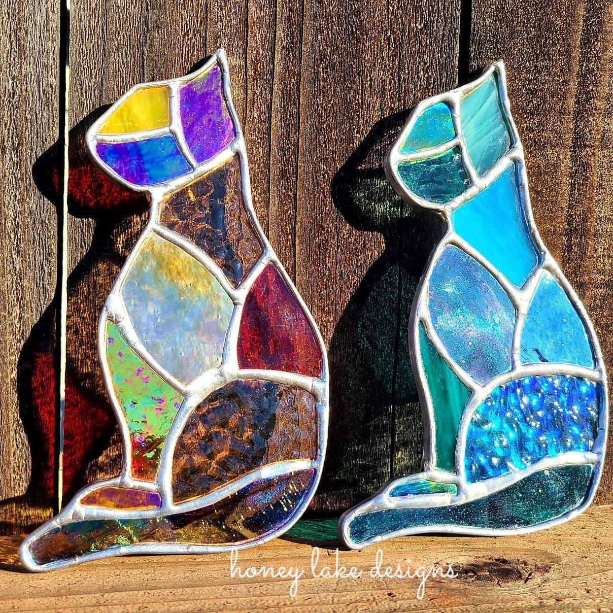 Glass cats by Jen Artist